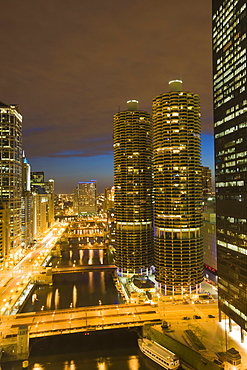 Skyscrapers lining the Chicago River and West Wacker Drive at dusk, Marina City on the right, Chicago, Illinois, United States of America, North America