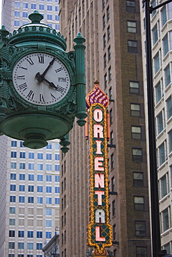 Marshall Field Building Clock and Oriental Theatre sign, Theatre District, Chicago, Illinois, United States of America, North America