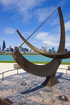 Sundial sculpture at the Adler Planetarium sundial and city skyline, Chicago, Illinois, United States of America, North America