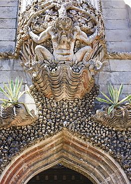 Fierce gargoyle above archway, Pena National Palace, UNESCO World Heritage Site, Sintra, Portugal, Europe