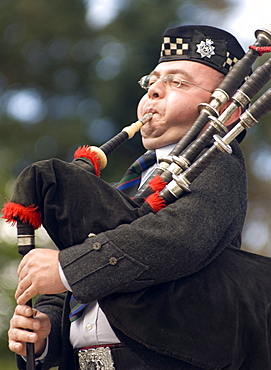 Piper blowing the pipes, Scottish Highland Games, Ballater, Aberdeenshire, Scotland, United Kingdom, Europe