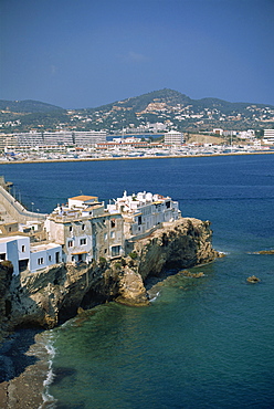 Houses built on outcrop, with Ibiza Town in background, Ibiza, Balearic Islands, Spain, Mediterranean, Europe