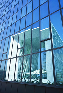 La Grande Arche reflected in nearby building, La Defense, Paris, France, Europe