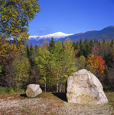 Large stone with plaque removed in forest during autumn, with Mount Washington behind, White Mountains National Forest, New Hampshire, New England, United States of America, North America