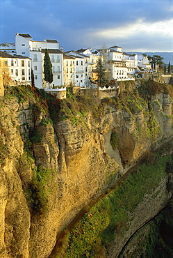 Houses perched on cliffs, Ronda, Andalucia, Spain 