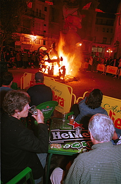 Valencia - Spain - Las Fallas Fiesta - Having a drink whilst watching a small ninot burn 