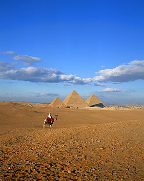 Camel rider at Giza Pyramids, Giza, UNESCO World Heritage Site, Cairo, Egypt, North Africa, Africa