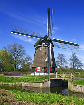 Canal and thatched windmill at Edam, Holland, Europe