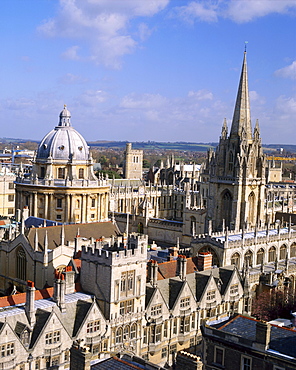 Aerial view over the dome of the Radcliffe Camera and a spire of an Oxford college, Oxford, Oxfordshire, England, UK 