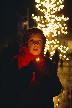 Young child singing Christmas carols, Trafalgar Square, London, England, United Kingdom, Europe