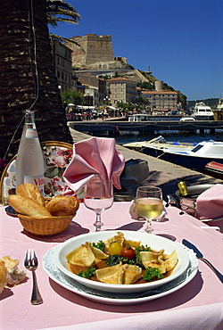 Meal on an outdoor table of the La Caravelle Restaurant, Bonifacio, Corsica, France, Europe