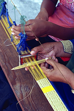 Weavers hands using a narrow loom in the Maldive Islands, Asia