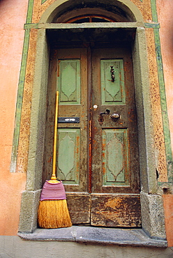 Doors and broom, Ardez, Switzerland, Europe