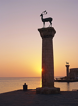 Entrance to Rhodes Harbour at dawn, Rhodes, Dodecanese Islands, Greece, Europe