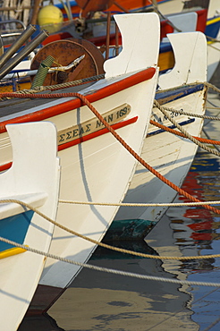 Close up of the front of three fishing boats in the harbour, Sitia, Crete, Greek Islands, Greece, Europe