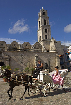 Elegant woman riding in horse and carriage, Plaza San Fransisco de Asis, Havana, Cuba, West Indies, Central America