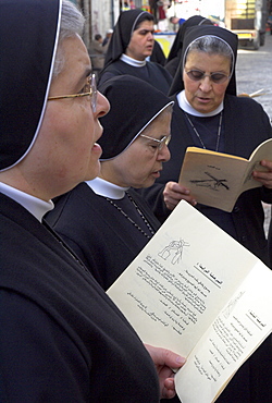 Group of Palestinian nuns praying on Good Friday at the Third Station of the Cross, Via Dolorosa, Old City, Jerusalem, Israel, Middle East