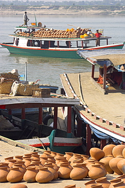 Wooden boats transporting pottery on the Ayeryarwady (Irrawaddy) River, Mandalay, Myanmar (Burma), Asia