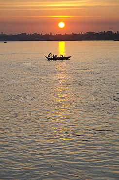 Traditional rowing boat on the river at sunset, Pathein, Irrawaddy Delta, Myamar (Burma), Asia