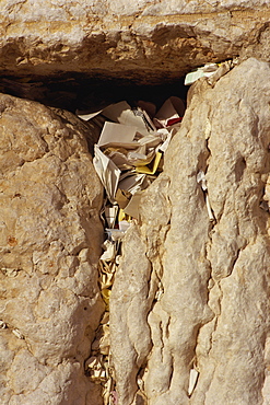 Close-up of notes and prayers placed in a crack on the Western Wall in Jerusalem, Israel, Middle East