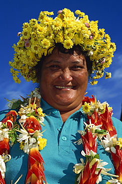 Woman arrives by plane adorned with flowers, Rarotonga, Cook Islands, Pacific