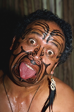 Traditional Maori war paint and tongue out, Rotorua, North Island, New Zealand, Pacific