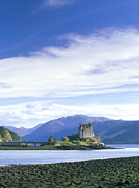 Eilean Donan castle at low tide, MacRae stronghold on small island in Loch Duich, built in 13th century to ward off the Vikings, Dornie, Highland region, Scotland, United Kingdom, Europe