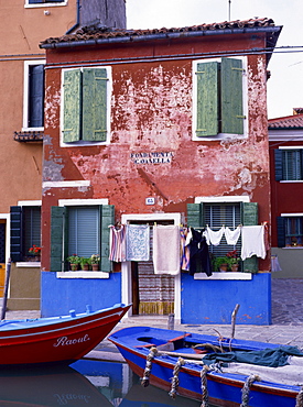 A typical canalside house, with washing line, in Burano, Venice, Veneto, Italy, Europe