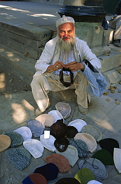 Man knitting woollen caps, Istanbul, Turkey, Europe