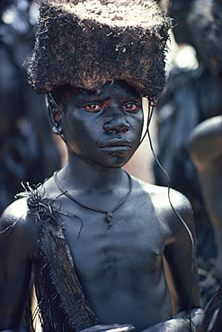 Portrait of a boy covered in pig-fat and charcoal in Papua New Guinea, Pacific Islands, Pacific