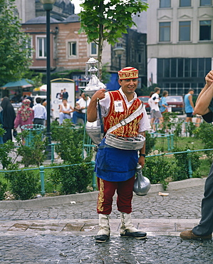 Portrait of a drinks seller, a man in traditional clothing, outdoors in the street, Istanbul, Turkey, Europe