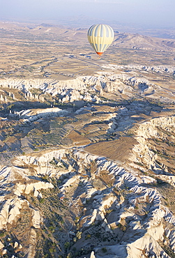 Hot air ballooning over rock formations, Cappadocia, Anatolia, Turkey, Asia Minor, Asia