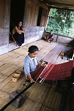 Ngada woman weaving ikat cloth, Bena Village, Flores, Indonesia, Southeast Asia, Asia