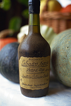 Close-up of an old bottle of Calvados from Normandy, France, Europe