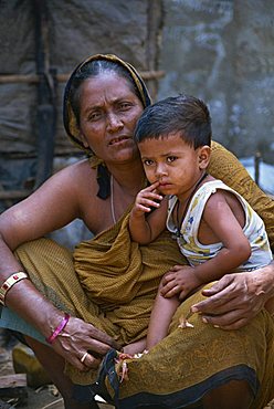 Mother and son in a slum in Dhaka, Bangladesh, Asia