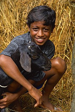 Boy and goat, Char Kukri Mukri, Bangladesh, Asia