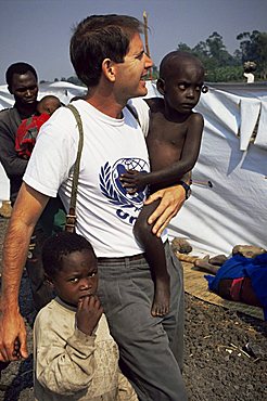 UNICEF representative with orphans, Goma, Zaire, Africa