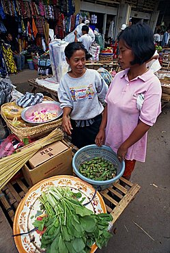 Two women selling vegetables from a stall in the market at Ubud on the island of Bali, Indonesia, Southeast Asia, Asia