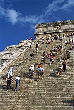 Tourists climbing El Castillo, pyramid dedicated to the god Kukulcan, Chichen Itza, UNESCO World Heritage Site, Yucatan, Mexico, North America