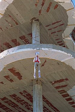 Stuffed dummy hung on building as good luck charm, Saranda, Albania, Europe