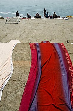 Washing at the ghats on the Narmada River at the Ahilya Fort and Temples, Maheshwar, Madhya Pradesh state, India, Asia