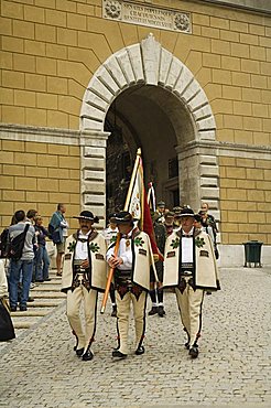 Funeral procession coming through one of the main gates to Wawel Castle and Cathedral, Krakow (Cracow), UNESCO World Heritage Site, Poland, Europe