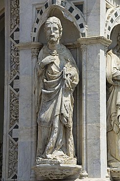 Statues at the base of the bell tower to the Palazzo Pubblico, Siena, Tuscany, Italy, Europe