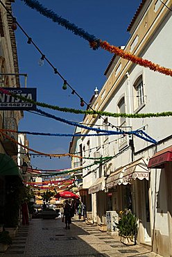 PORTUGAL, ALGARVE, SILVES, Street in Silves decorated for Palm Sunday celebrations