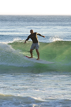 Surfer at Arrifana beach, Algarve, Portugal, Europe