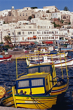 Fishing boats in the harbour with town in the background on the island of Naxos, Cyclades Islands, Greek Islands, Greece, Europe