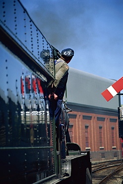 Train driver and signal reflection, Bridgnorth Railway Station, Shropshire, England, United Kingdom, Europe