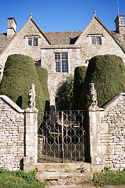 Cotswold house, topiary and gate, Ablington, Gloucestershire, The Cotswolds, England, United Kingdom, Europe