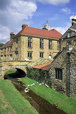 Town hall from stream, Helmsley, North Yorkshire, Yorkshire, England, United Kingdom, Europe