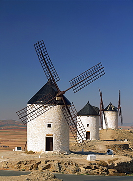 A line of windmills above the village of Consuegra, Ruta de Don Quixote, Castile la Mancha (Castilla la Mancha), Spain, Europe